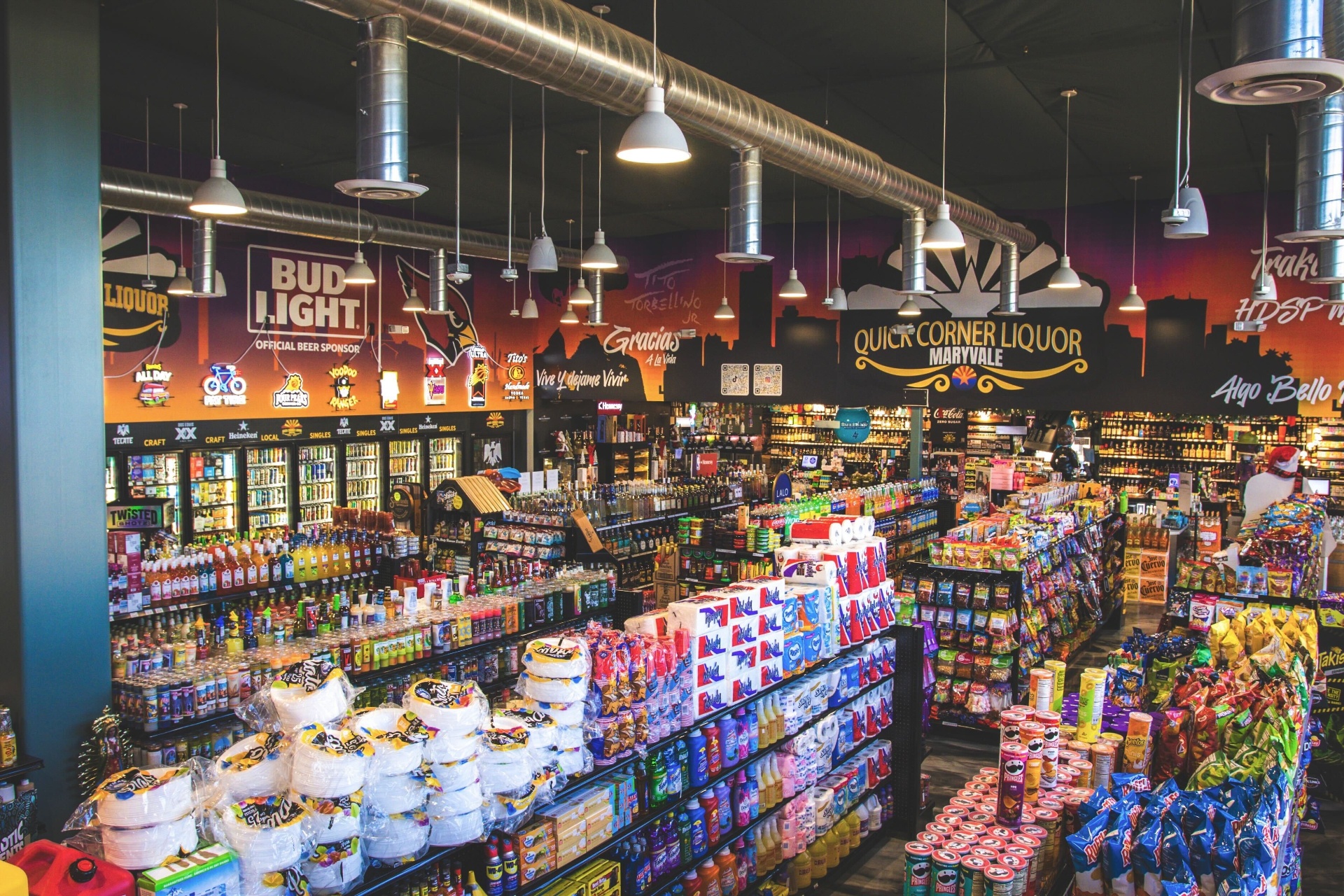 Quick Corner Liquor Maryvale storefront mural with Bud Light, Cardinals, and Arizona skyline neon