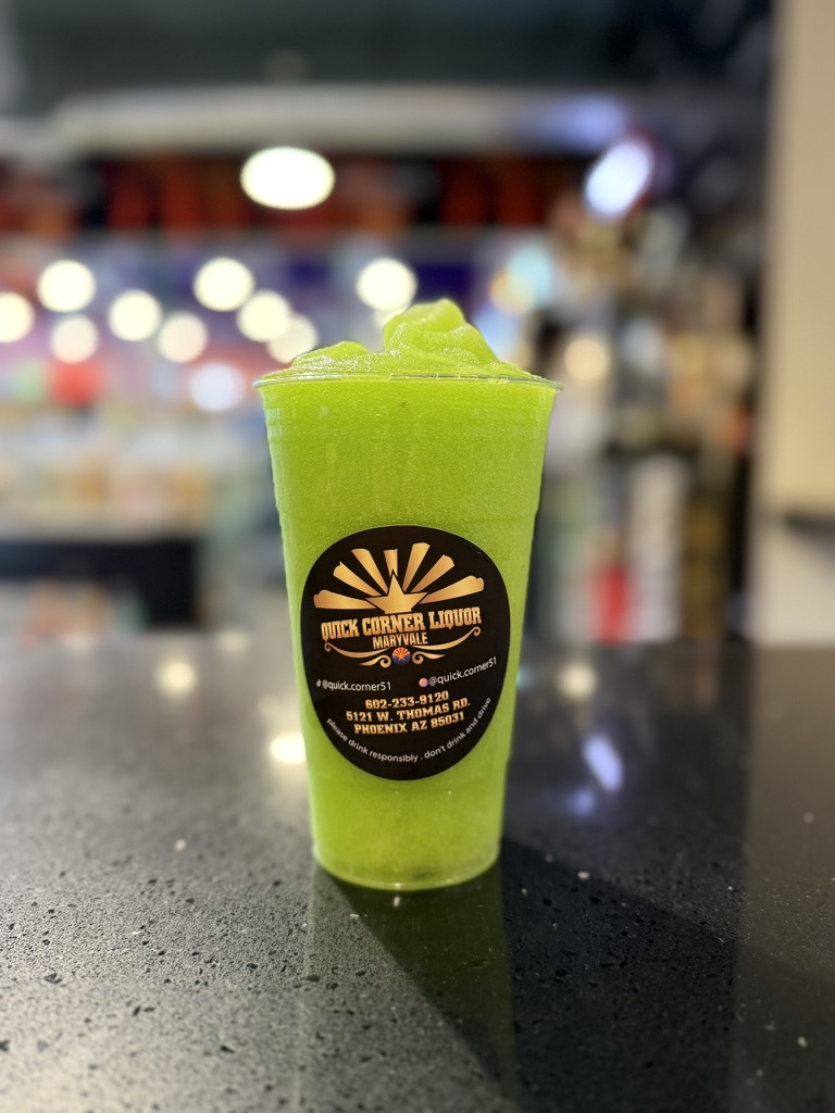 Bright green Incredible Hulk slushie made with Hennessy and Hpnotiq