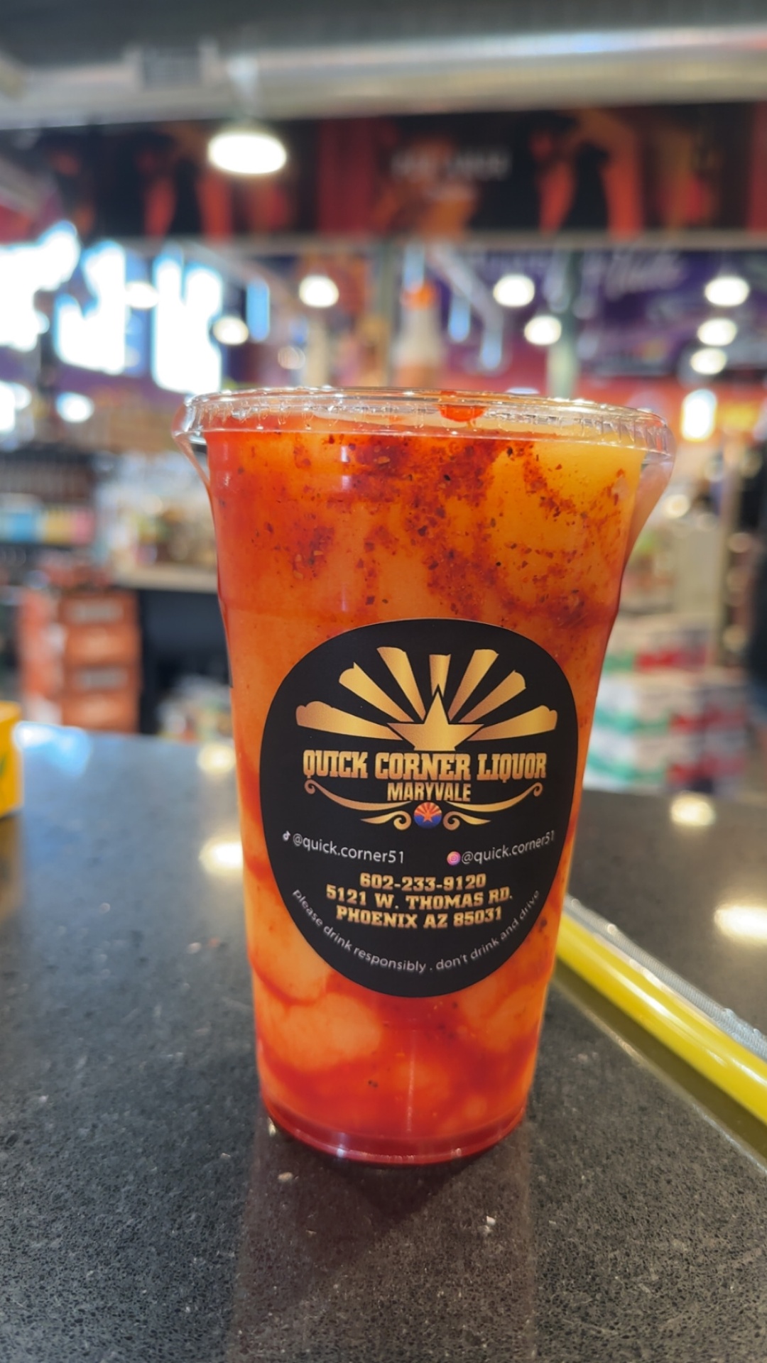 Chamoy-rimmed mangonada slushie with Tajín in a Quick Corner Liquor cup, Phoenix