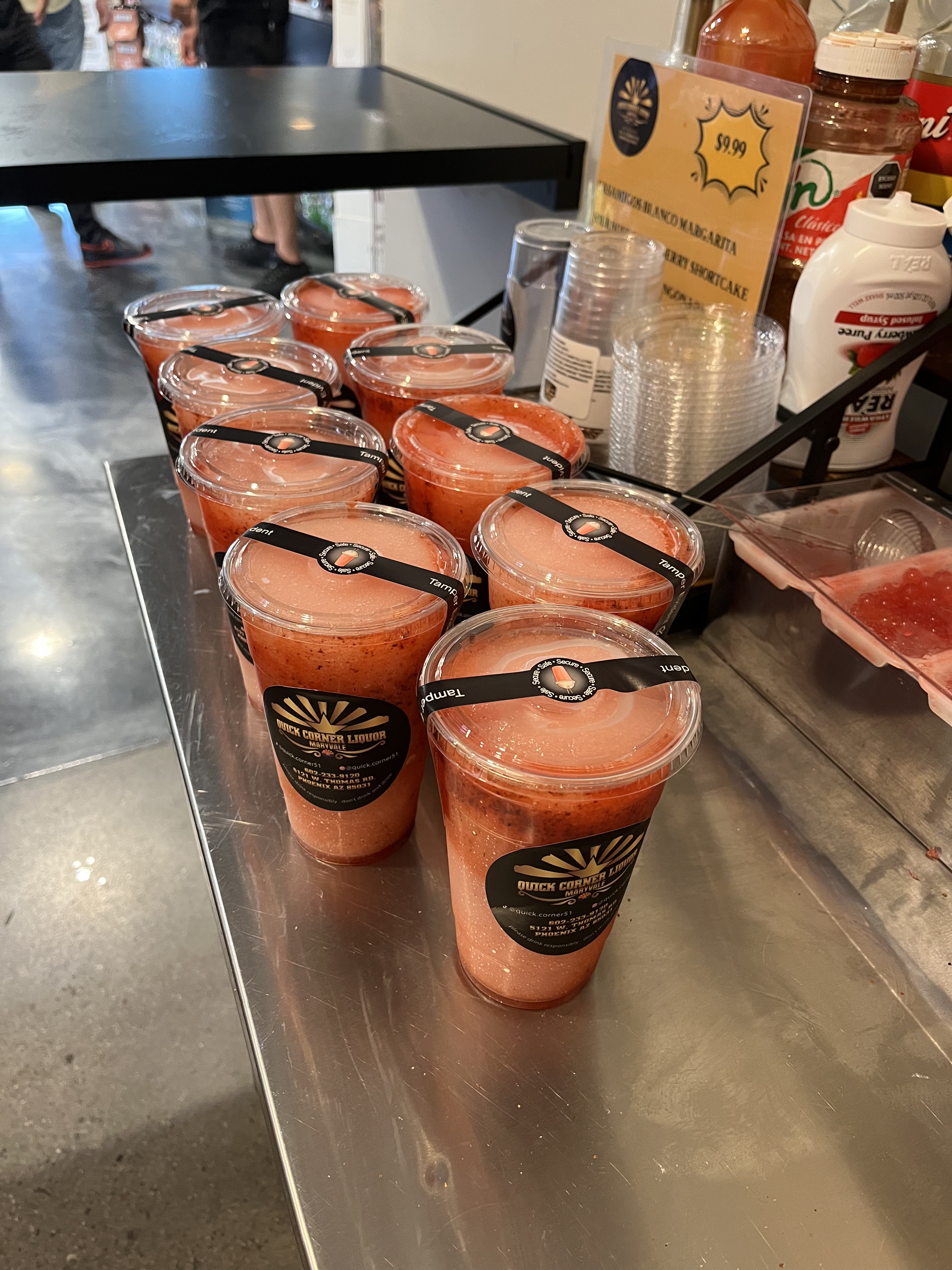 Tray of strawberry alcohol slushies ready for delivery from Quick Corner Liquor Maryvale